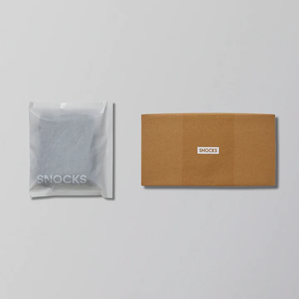 Two Snocks packages: a plastic pouch and a cardboard box.